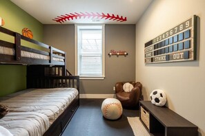Just through the queen green bedroom, this room has a sporty vibe with a double decker bunk bed.