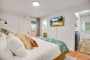 Bedroom 1. King-sized memory foam mattress, smart TV, lots of closet space, and room-darkening shades. Window A/C for your comfort. En suite bathroom attached.