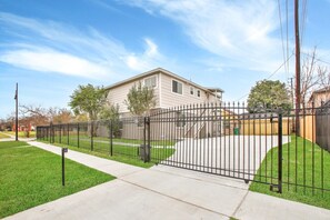 Here's a peek at the driveway and access code keypad, offering easy entry to your home away from home. Feel the excitement as you pull in, knowing that relaxation and convenience are just moments away.