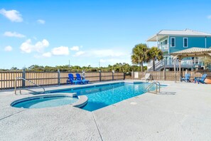 Crystal blue community pool with kiddie pool