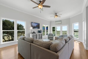 Large spacious living area with flat screen tv