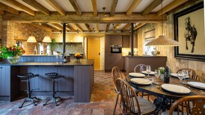 Dine in the historic Coach House beneath wooden beams