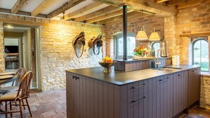 A nod to its heritage, leather saddles hang from the wall in the Coach House