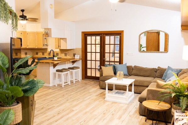 Main living space-French doors ( with privacy curtains) to Master bedroom