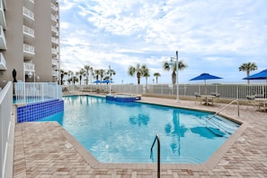 Majestic Sun has a large pool, two hot tubs on the elevated, and spacious patio with plenty of seating and shade overlooking the shimmering Gulf of Mexico.