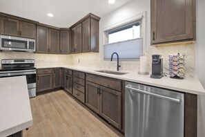 Large sink with garbage disposal and coffee available