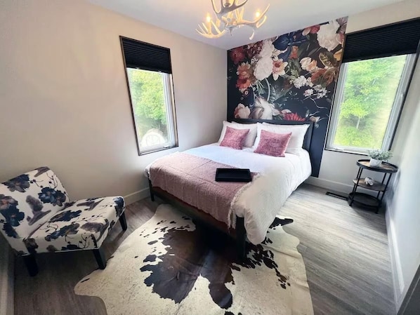 The Falling Flower suite features windows throughout for lots of natural light and a luxurious queen-sized bed for your comfort.