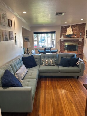 The living area is cozy, with a big-screen TV, DVD player and lots of screeners