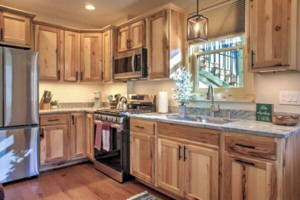 Beautiful, well-stocked kitchen.