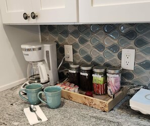 Fully equipped coffee / tea station with essentials.