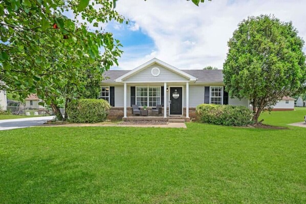 Spacious front yard with a porch.