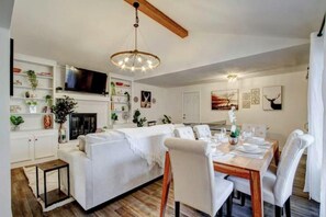 Large, open concept living and dining area with an added ping pong table!