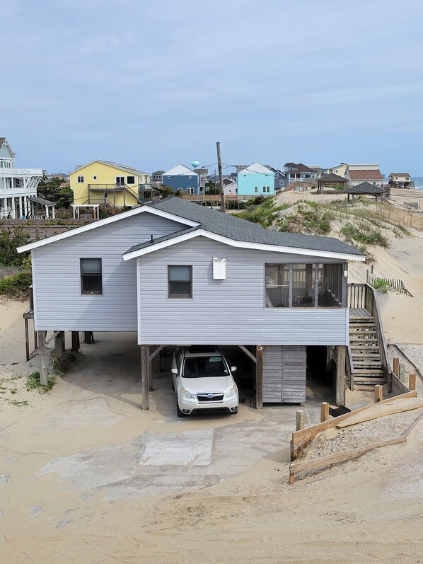 The cottage is the second house back from the beach (behind the dune).