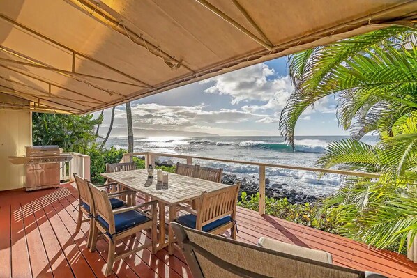 Immerse yourself in one of the deck's most stunning views, embracing the sea breeze where waves and wine meet.