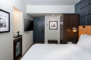 An inviting bedroom with plush bedding and thoughtful touches of elegance ensures a restorative sleep.