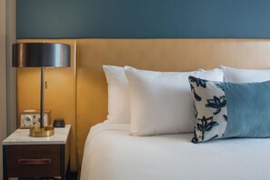 Elegant bedding and artistic touches infuse this room with charm, ensuring a stylish and comfy stay.