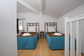 The second bedroom contains 2 Single beds.
