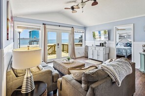 Relax in the spacious Living Area with views of the ocean and a Flat Screen TV for your comfort.