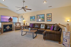 The spacious Living Area offers plenty of cozy furniture, a large, Flat Screen TV, and gorgeous views.