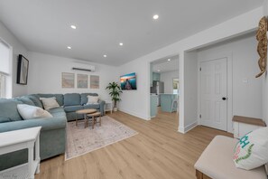 Living room with couch that reclines on both ends