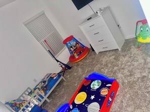 Kids room with TV. A pack n play is also provided and is located in the closet.