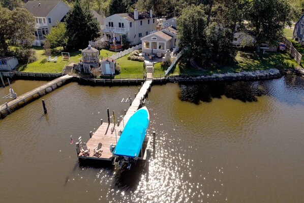 The private pier at the waterfront Treetops on the Bodkin (boat lift and boat not included in rental).