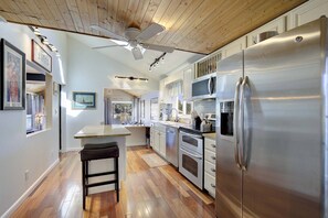 The main floor fully-stocked kitchen has easy access to the dining room and family room.
