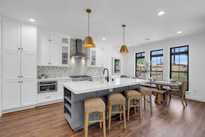Sit at the Kitchen island or dining room table