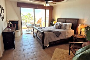 Master bedroom with king bed and patio access