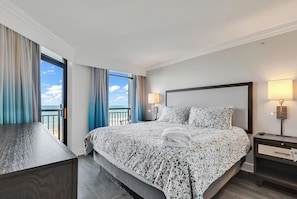 Primary bedroom with a king bed, views, access to the deck, TV,  and private bathroom.  We provide all linens for you.