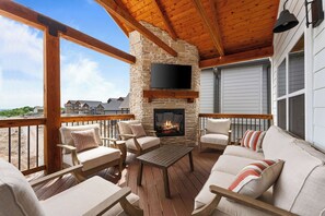 Enjoy cool evenings gathered around the fireplace on the back deck watching the big game!