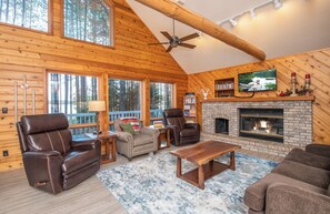 Living Room with fireplace and wall of windows.