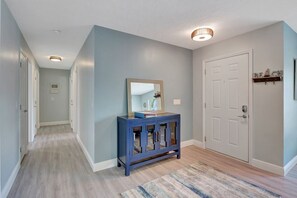 View of front door from living room