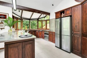 Whip up a feast in the U-shaped kitchen with plenty of prep space and well-equipped with modern appliances.