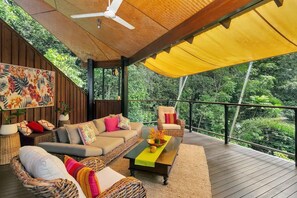 The entertainer’s deck on the top floor is the ultimate relaxation space with plush and vibrant furnishings.