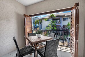 Furnished with a four-seater table, the balcony is ideal for alfresco meals and soaking up the tropical atmosphere.
