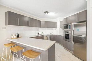 The fully equipped kitchen provides everything you need for culinary creativity, boasting modern appliances and ample counter space to make meal preparation a breeze.
