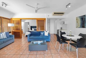 The open-plan layout ensures a light and airy atmosphere, ideal for unwinding after a day at the beach.