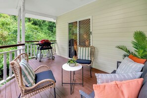 Dine al fresco or unwind with a glass of wine on the spacious balcony. Complete with a BBQ and lounge suite, it's an ideal spot for enjoying the tropical ambience.