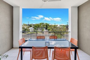 Step out onto the sunny balcony from the living area, furnished with alfresco dining furniture. It’s the perfect spot for enjoying meals outdoors or savouring a morning coffee.