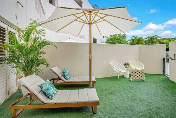 The sprawling private terrace is the highlight of this coastal abode. 