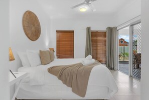 The primary bedroom offers a cosy queen bed, an attached ensuite, and ample storage space. Unwind in comfort and wake up refreshed for another day of adventure.