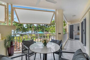 The private balcony with seating is perfect for enjoying an alfresco meal or simply soaking up the sunshine.