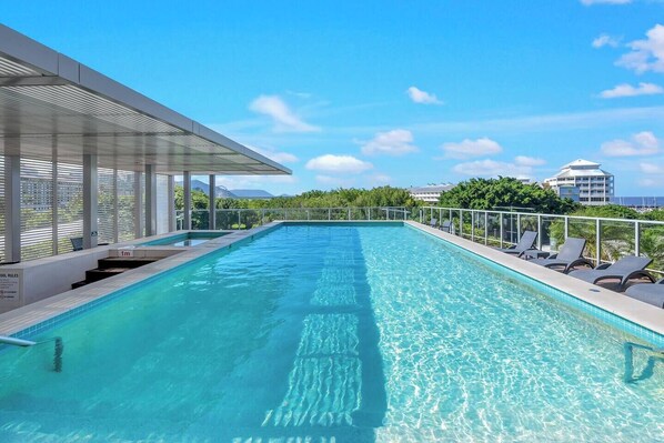 Dive into the scenic swimming pool and deck area, providing stunning views and a perfect spot to relax and unwind.
