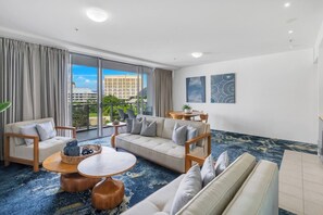 Experience the comfort of the spacious living room, featuring modern furnishings and abundant natural light.