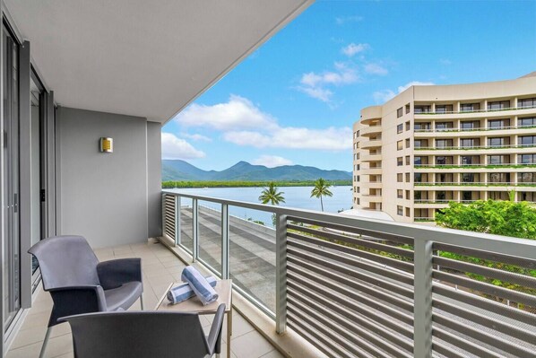 Step out onto the private balcony to take in the breathtaking panoramic views of the Cairns inlet and cityscape.