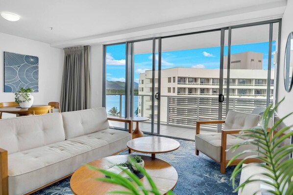 The living room provides a cosy retreat with ample seating, perfect for unwinding after a day of exploring the city.