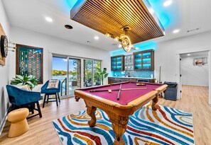 Rack 'em up in the game room where style & play mingle. From pool to chats, it's all about the fun here by the lake.