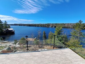 View of North Lake Joseph w/ Fire Pit (Left), Swim Dock & Diving Board (Middle).