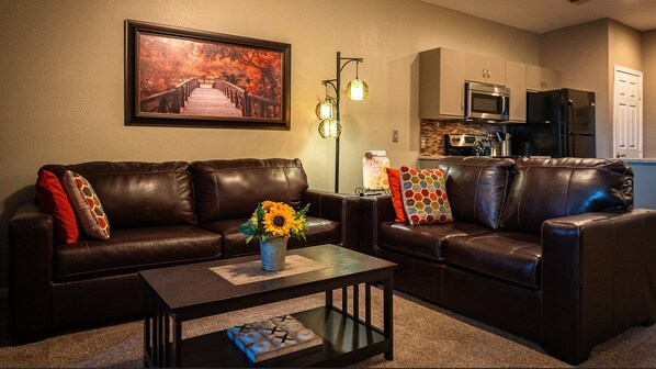 Luxurious leather loveseat and queen sleeper sofa.